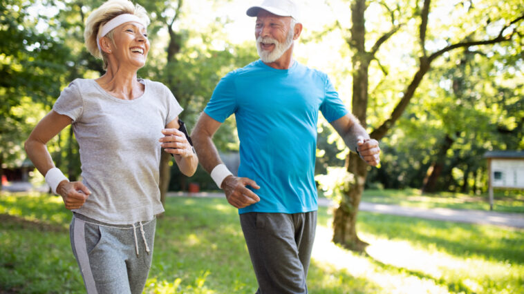 Beautiful,Mature,Couple,Jogging,In,Nature,Living,Healthy