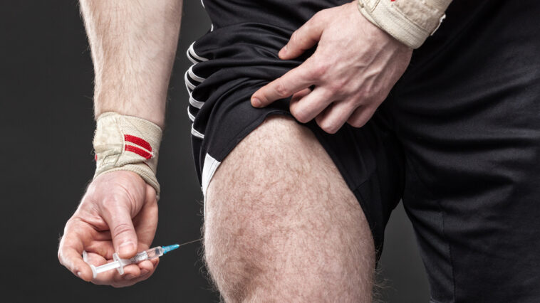 Close,Up,Of,A,Muscular,Man,Injecting,Himself,With,Steroids.
